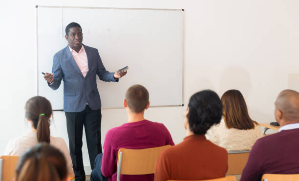 istock Multinational students with  coach at  business school 1296904279