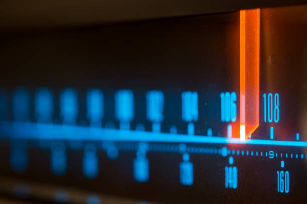 istock Classic radio tuner panel close-up. Black background 1296905707