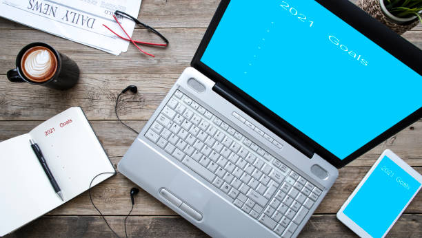 istock laptop computer over wooden office desk 1296906567