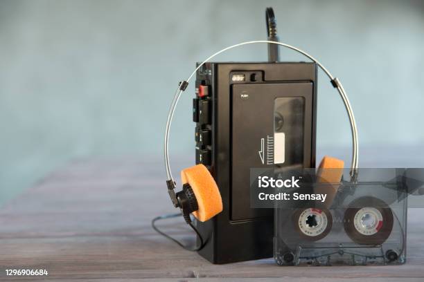 Old Portable Cassette Player And Headphones On A Abstract Background Vintage Advertisement Style Stock Photo - Download Image Now