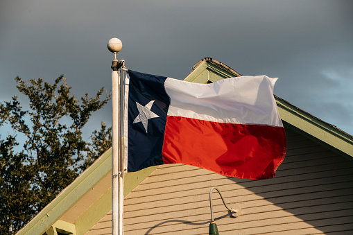 Texas flag at sunset in rural Texas
