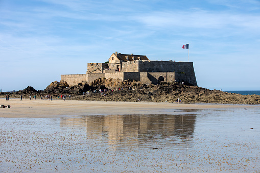 St Malo, France - September 15, 2018:  View of the Fort National and beach n Saint Malo  Brittany, France