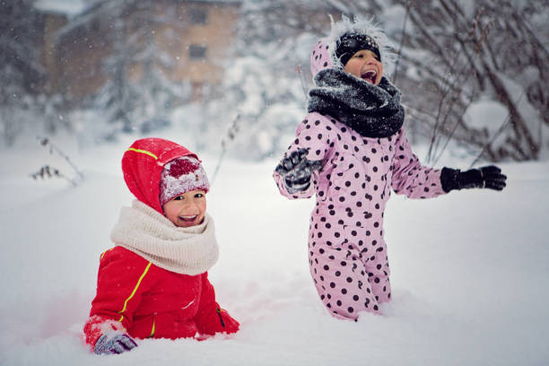 Happy boys enjoying snow