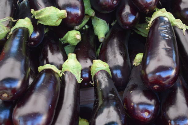 istock Aubergine in a market stall 1296916876