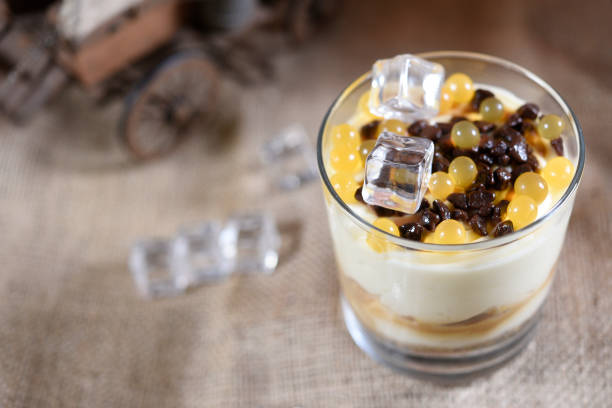istock sweet chocolate marbles with white milk in glass 1296919227