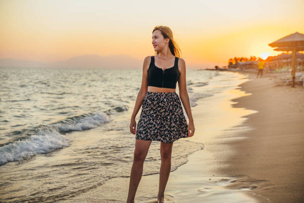 istock Young woman on the beach 1296919307