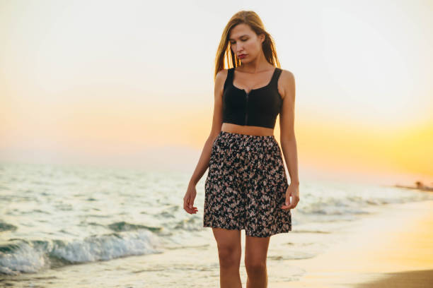 istock Enjoying the beach on sunset 1296919466