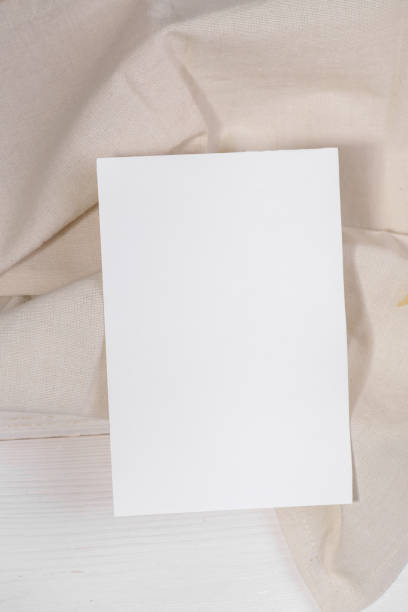 istock Card mockup template, empty stationery card with dry plants flower 1296919580