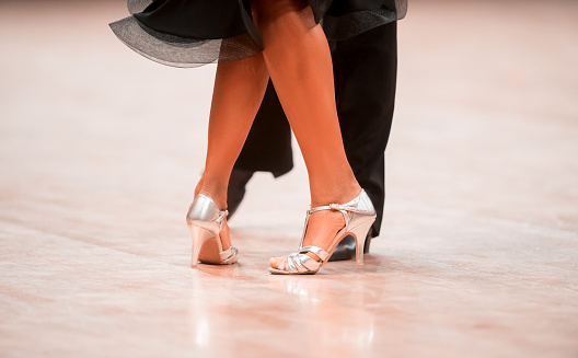 Man and woman dancer latino international dancing.  Ballroom dancing is a team sport. Vintage color filter