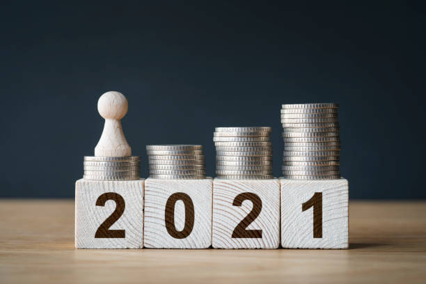istock Money coins stack stair as step growing growth and wooden cube block 1296921204