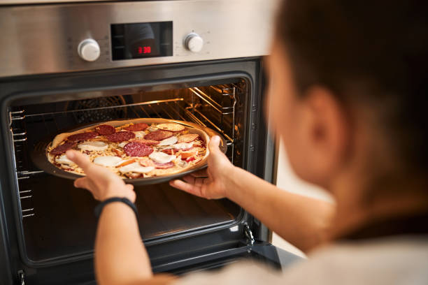 istock Homemade pizza being almost ready and needs to be baked 1296921589