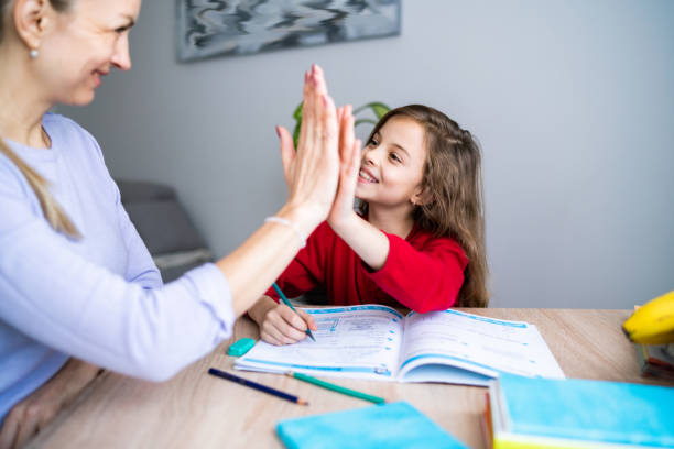 istock Mom is proud of her daughter how she study in home quarantine 1296922490