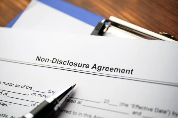 legal document non-disclosure agreement on paper close up. - employ imagens e fotografias de stock