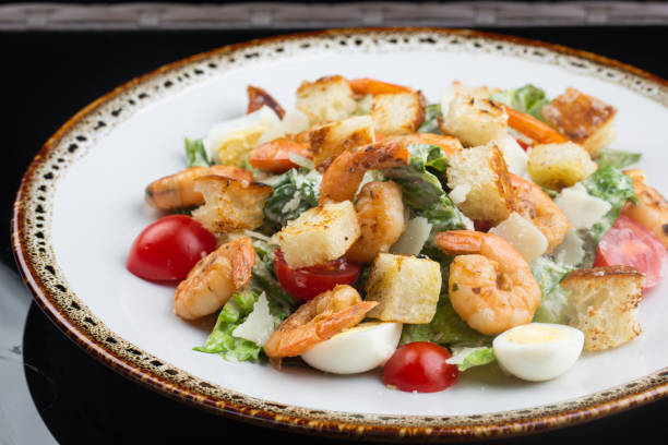 istock salad with shrimps, lettuce, cherry tomatoes, quail eggs and crispy rye croutons 1296930612
