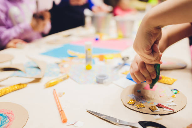 istock Master class to create a flower from paper.Children's creativity.Favorite hobby for children.Materials and tools. 1296932165