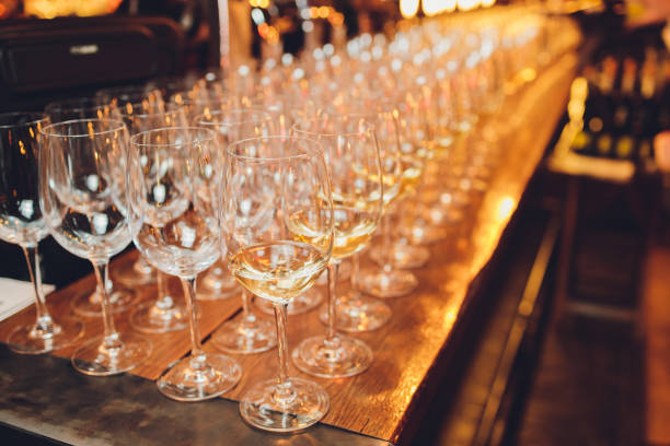 istock Refreshing White Wine in a Glass on a Background. 1296932195