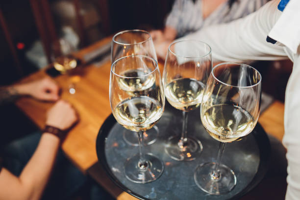 istock Refreshing White Wine in a Glass on a Background. 1296932202