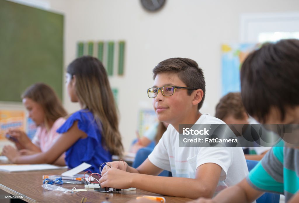Upper Elementary Student In Classroom Stock Photo - Download Image Now ...