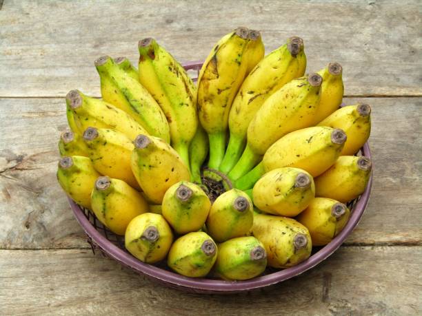 istock Fresh Bananas on a old wooden background 1296941108