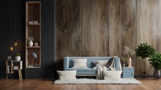 istock Living room interior has a sofa on empty a dark wood wall. 1296943821