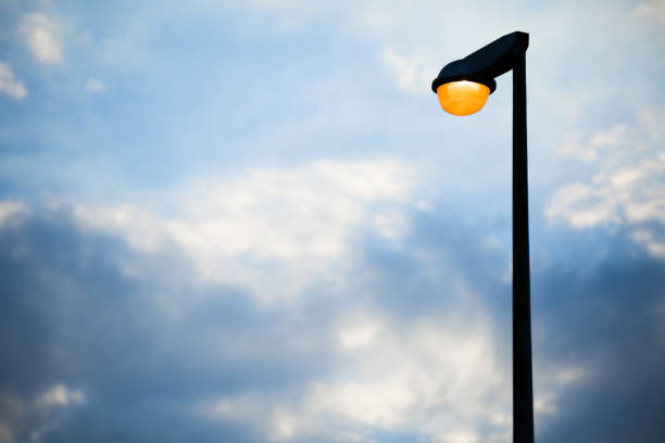 Street lamp on evening blue sky and clouds background and copy space