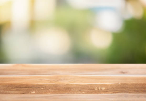 istock Wooden surface on a blurred natural background 1296944193