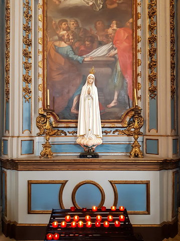 Church interior with statue of Virgin Mary of Fatima