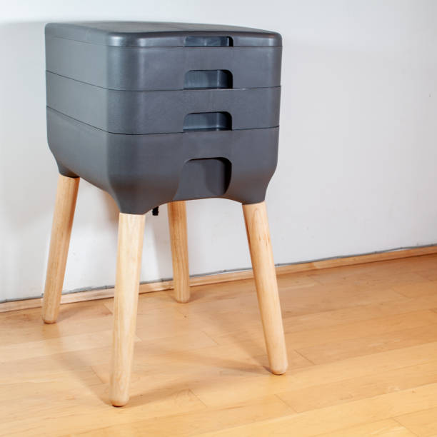 istock A sleek, modern looking indoor worm composter sits against a white wall. 1296948465