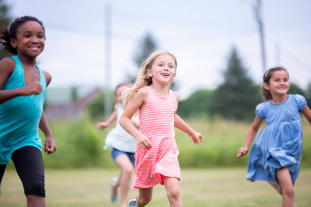 istock Children running outdoors together 1296949088