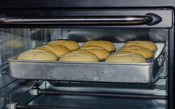 istock Homemade Cupcake is Baking in Oven. 1296949136