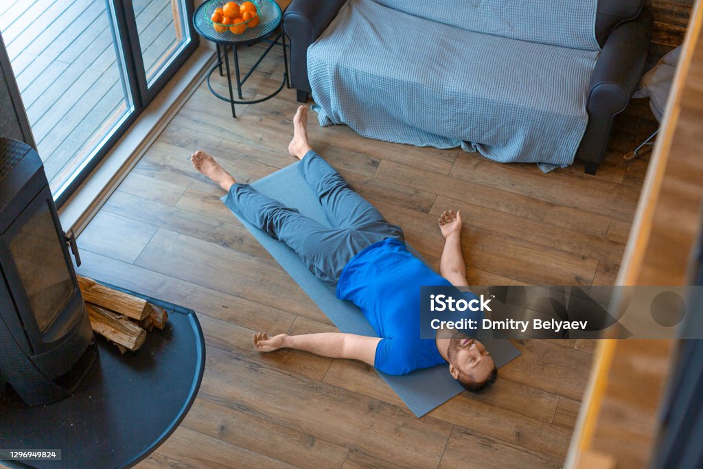 Relaxation practice. Yoga - shavasana Relaxation and mental health. Relaxation practice. Yoga - shavasana. Lying Down Stock Photo