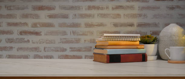 istock Study table in home office room with books, decorations and copy space on the table 1296950081