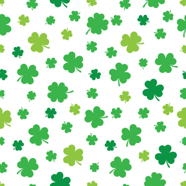 Three Leaf Clover Pattern 3 Vector illustration of green three leaf clovers in a repeating pattern against a white background. clover leaf stock illustrations