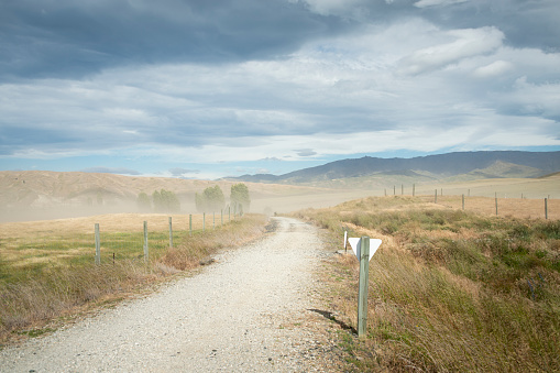 Strong wind blowing dust on Otago Central Rail Trail, South Island, New Zealand