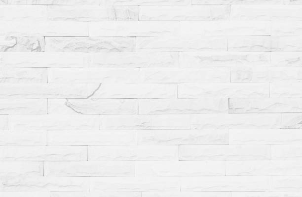 istock White grunge brick wall texture background for stone tile block painted in grey light color wallpaper modern interior and exterior and room backdrop design 1296954896