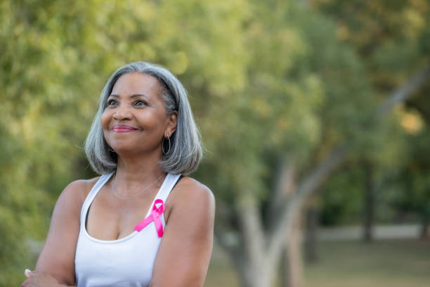 istock Senior woman smiling while outdoors 1296958236