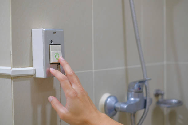 istock Patient hand pressing the emergency call button in the bathroom. Pressing nurse emergency call for helping. 1296961925