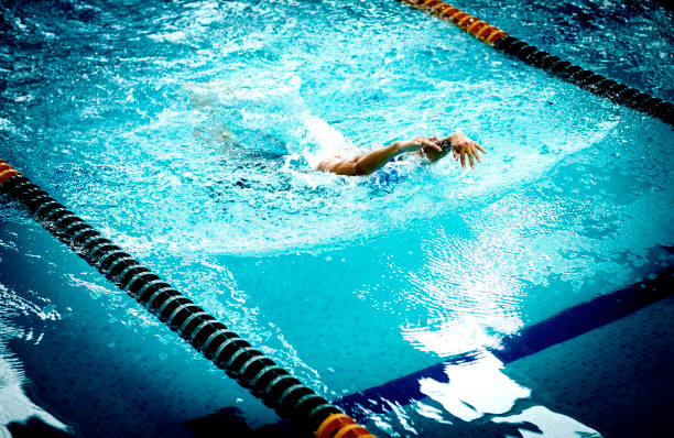 istock Young athletic man with swimming technique 1296965203