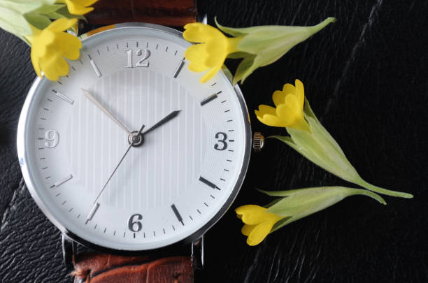 istock Watch with small yellow flowers 1296966952