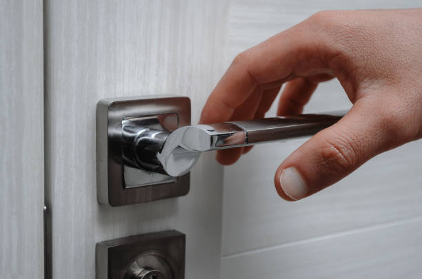 istock Without gloves touches the door handle 1296966954