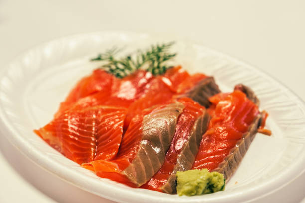 Japanese salmon sashimi platter, with wasabi, at an angle.