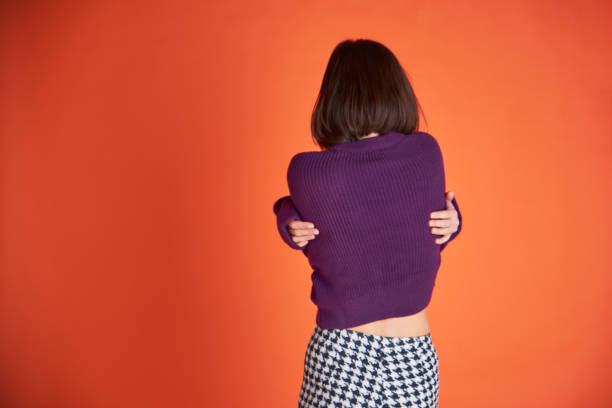 istock One Young woman wearing a purple sweater 1296972156