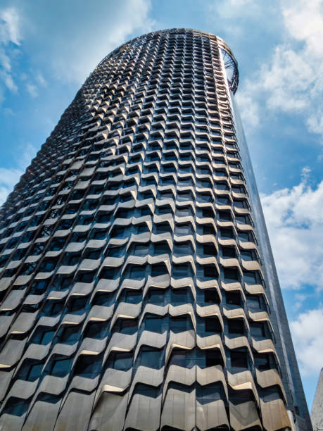 istock Modern architecture office tower building with blue sky in Singapore. 1296974238