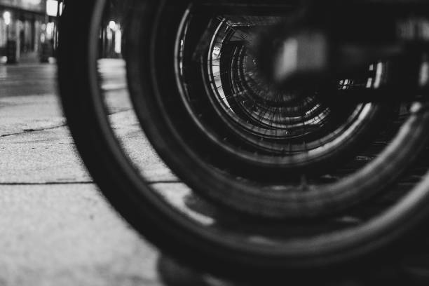 istock Street level view through bicycle wheels 1296975133
