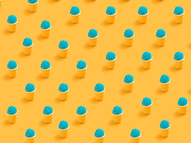 istock Minimal  concept .Trendy Candy pattern made with various  candy on bright light yellow background. 1296975147