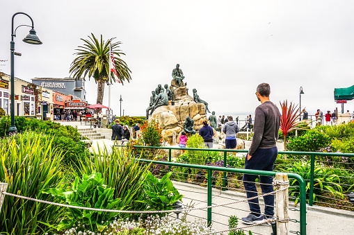 August 19, 2017, Monterey, California. Tourists and locals alike enjoy the shops and waterfront area of Monterey Bay. A great destination for all those who travel along the coastal highway of California. Famous for its aquarium and cannery, Monterey also offers scenic walks quaint shops, antique stores and many other opportunities for visitors to enjoy as they visit this area. Along the way tourist can also experience the various statues that can be seen along the shore