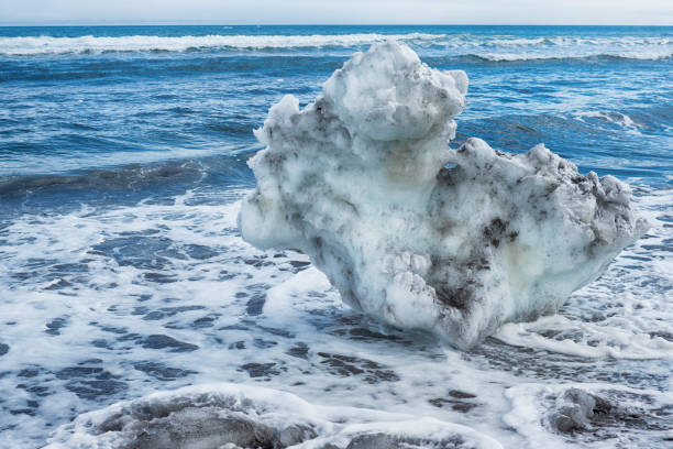 Ice blocks off the coast of the Pacific Ocean, washed ashore. stock photo