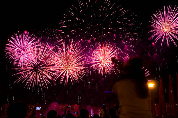 istock Beautiful colorful fireworks in the evening sky. 1296978537
