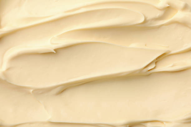 istock Mayonnaise sauce texture on whole background, close up 1296980323