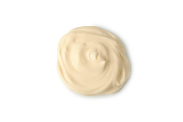 istock Mayonnaise sauce heap isolated on white background 1296981056